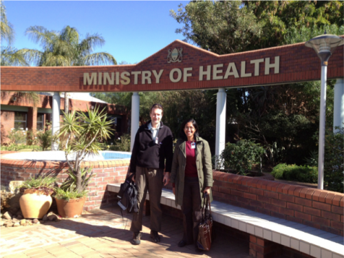 Dr. Richard Bucala (left) and Dr. Rita Das (right) in front of the Botswana Ministry of Health. Dr. Rita Das received her PhD for unearthing the association between MIF allele and TB susceptibility. Courtesy of Dr. Bucala.