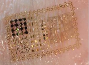 Discreet patches of ultrathin electronics may replace current EEG and EMG instruments, allowing for daily monitoring and measurements. Graphic courtesy of John Rogers.