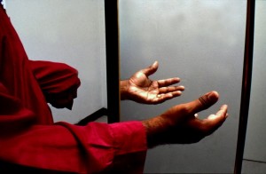 An amputee standing near a mirror, demonstrating the potential of Ramachandran’s mirror box. Image courtesy of the New Yorker.