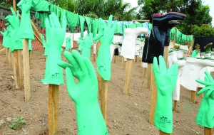 Personal Protective Equipment (PPE) is used to protect health workers from infection when treating Ebola patients.  Frequent disinfection is necessary.  (Courtesy of archiveglobal.org)  