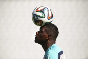 Portuguese national player William Carvalho tests out the new Brazuca ball before the World Cup. Image courtesy of the Washington Post.