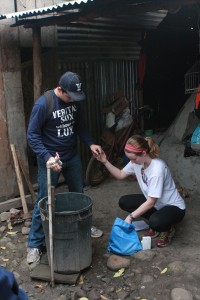 Students Maddy Landon and Benjamin Batolome collect tap water samples for testing. The water use in this home is typical for households in rural Nicaraguan communities. Image courtesy of Jaehong Kim.