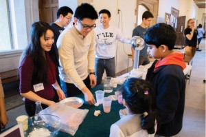 Yale undergraduate volunteers perform a demo for children at the first of this semester's Science on Saturdays. Photo by Suryabrata Dutta.