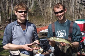 Researchers Andrew Jones (left) and Jakob Broderson (right) hold a sunfish and chain pickerel, respectively. Image Courtesy of Post Lab. 