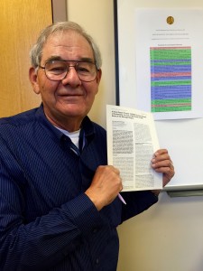 Rupp poses with the article he and Sancar published. Image courtesy of W. Dean Rupp.