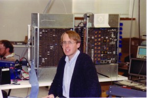 Lethin sits with the computer he was working on at the Yalie-founded startup Multiflow Computer. Image courtesy of Richard Lethin.